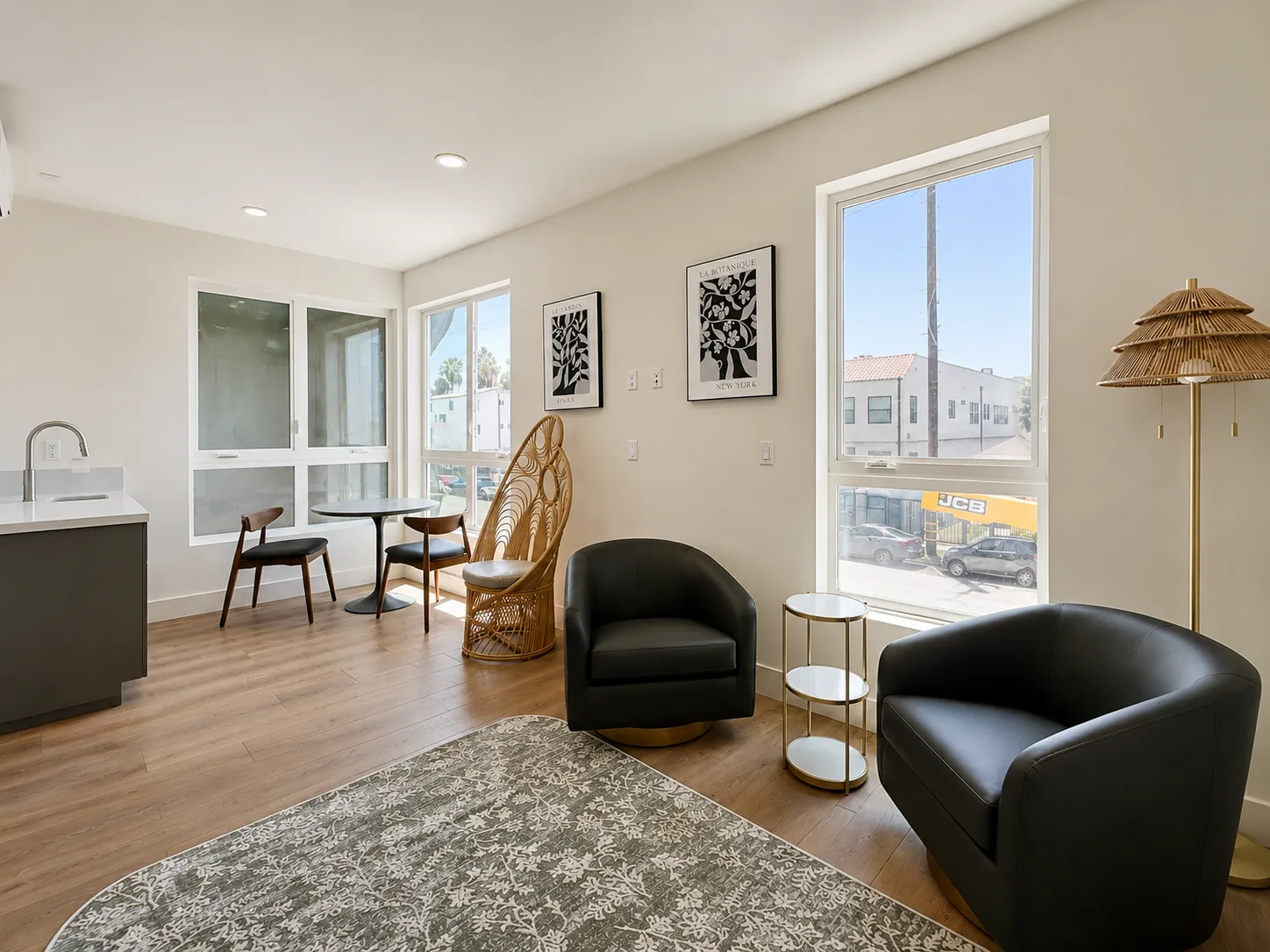 Actual Unit 202 shared living room with seating, dining space, and large windows